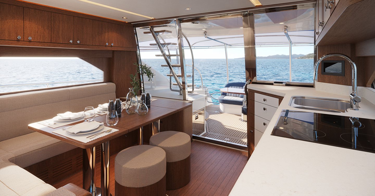 Riviera Belize 55 Daybridge boat interior with wooden dining table and galley 