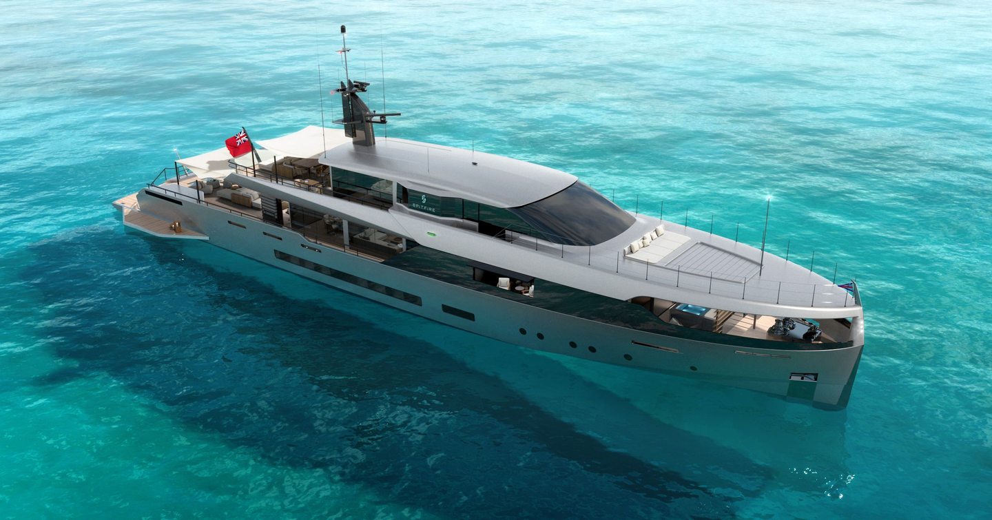 Motor yacht Spitfire at anchor on a clear blue sea 
