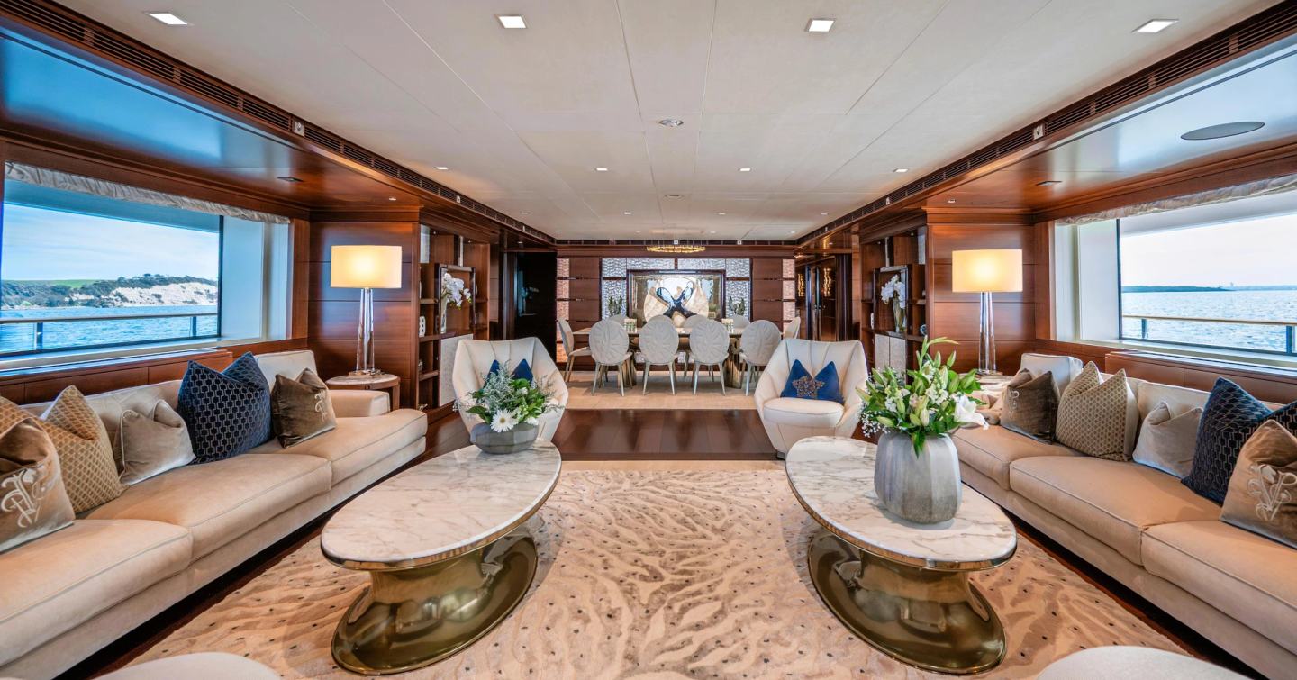 CRN Superyacht Odyssey main saloon with patterned rug and marbled coffee table