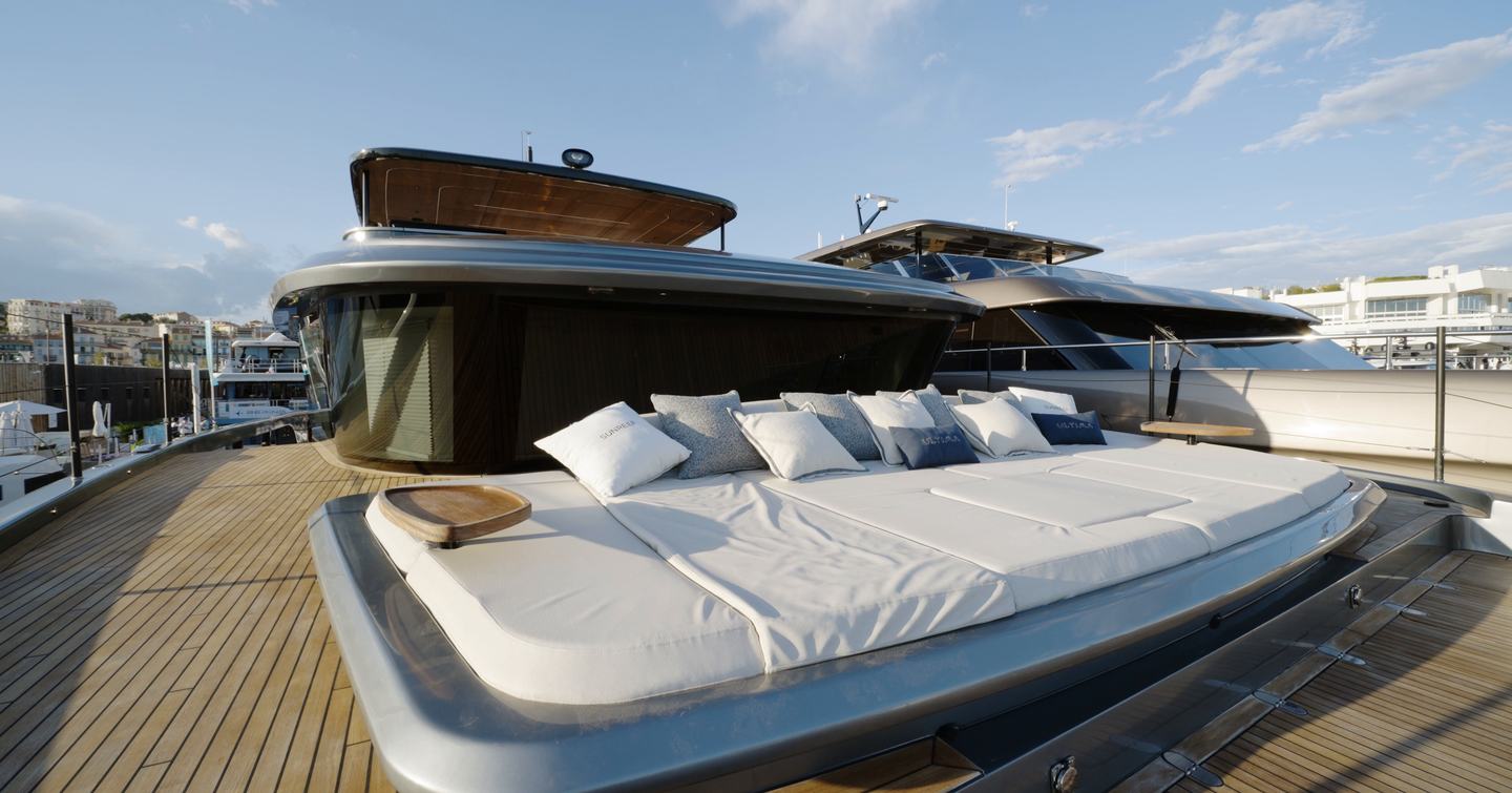 Sunreef Ultima 88 foredeck sunpad with adjustable backrests and teak side tables
