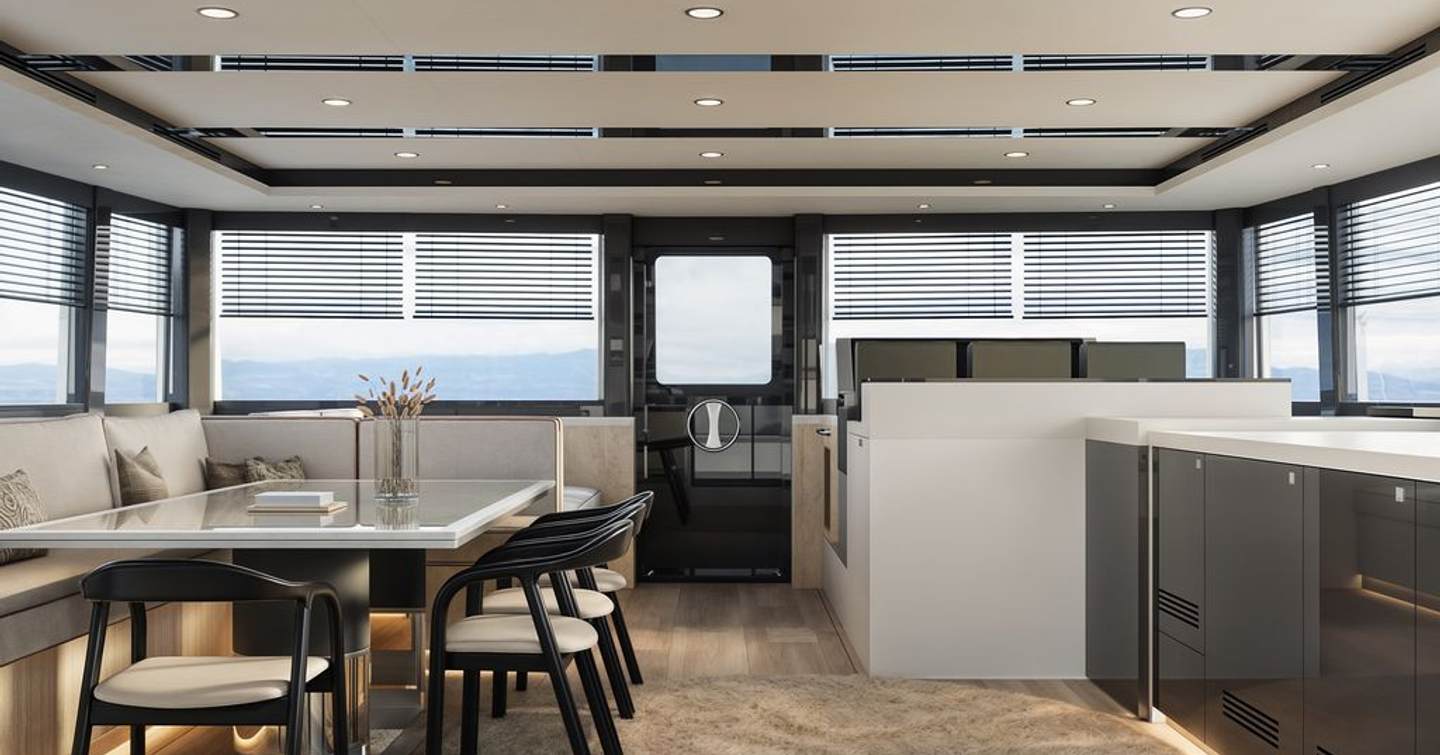 Rendering of VisionF 65 Hybrid Catamaran interior with neutral palette and starboard side dining area 