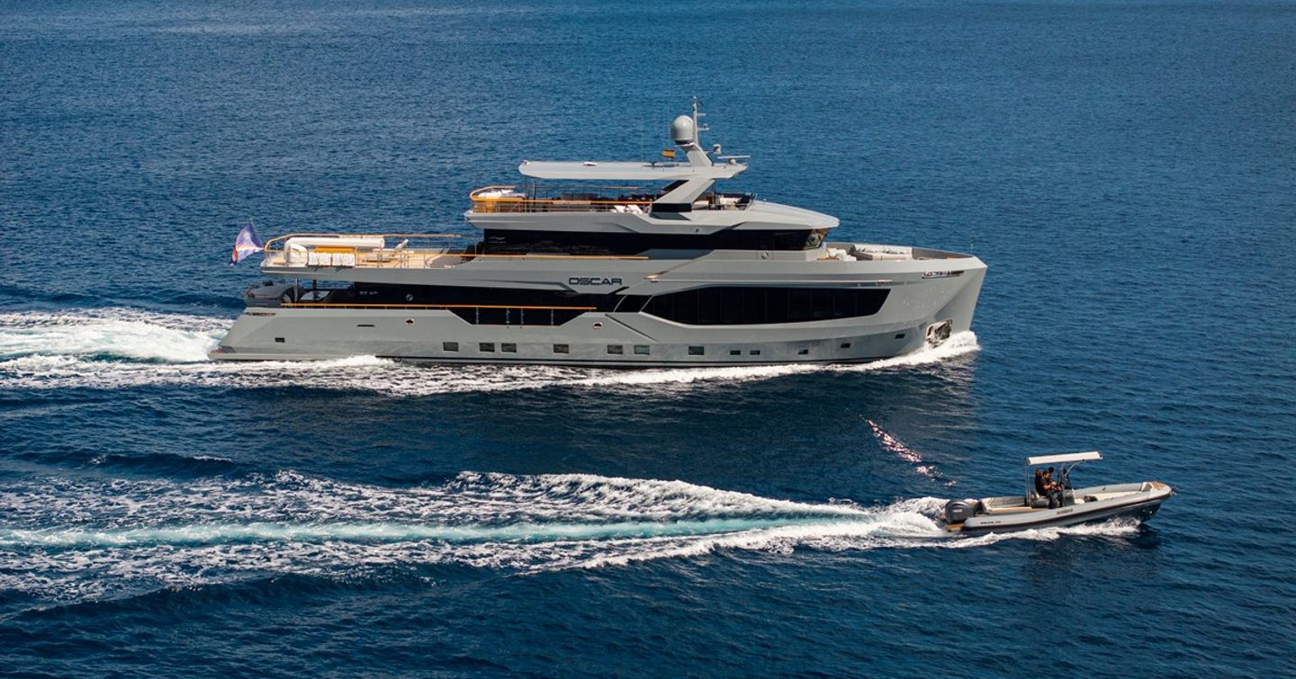 Superyacht Oscar's under way with tender adjacent 