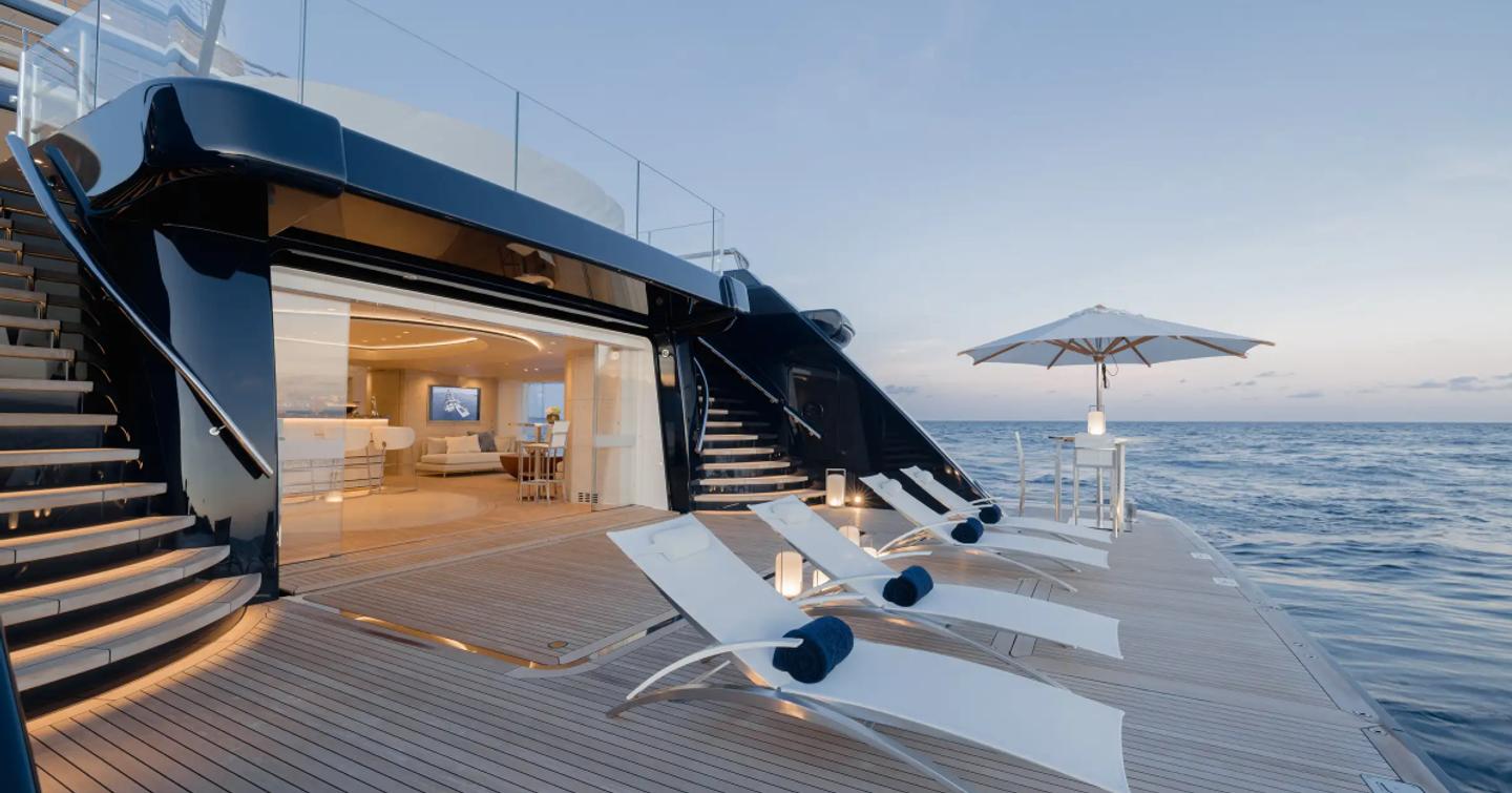 Superyacht Here Comes the Sun beach club with deck chairs 