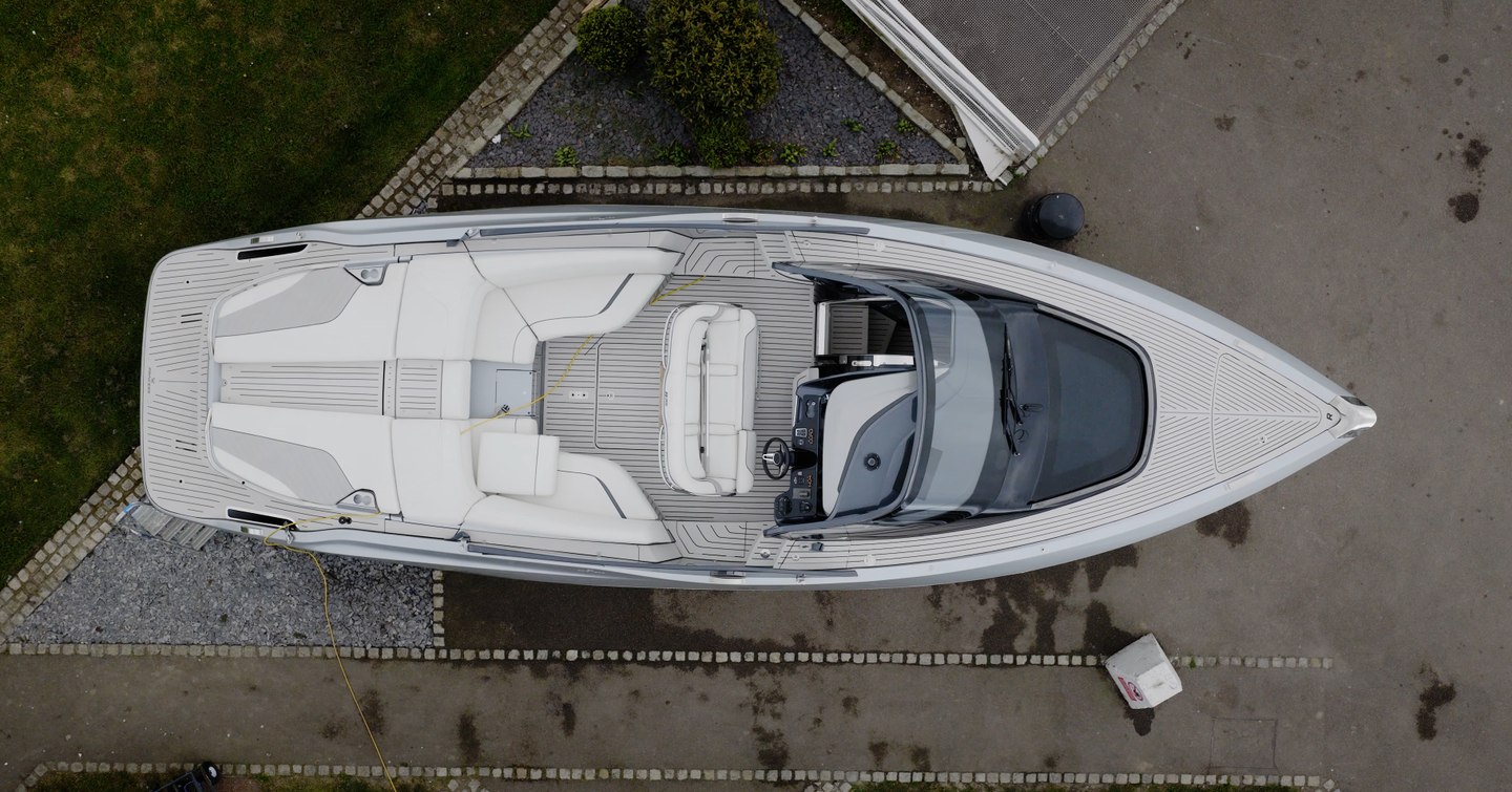 Princess R35 overhead in the marina showing aft deck sunpads