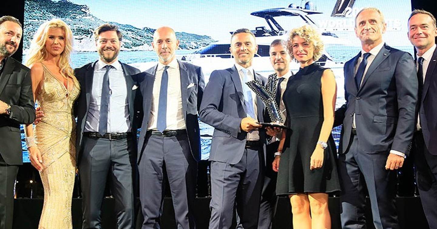 World Yachts Trophies winners on stage with trophy