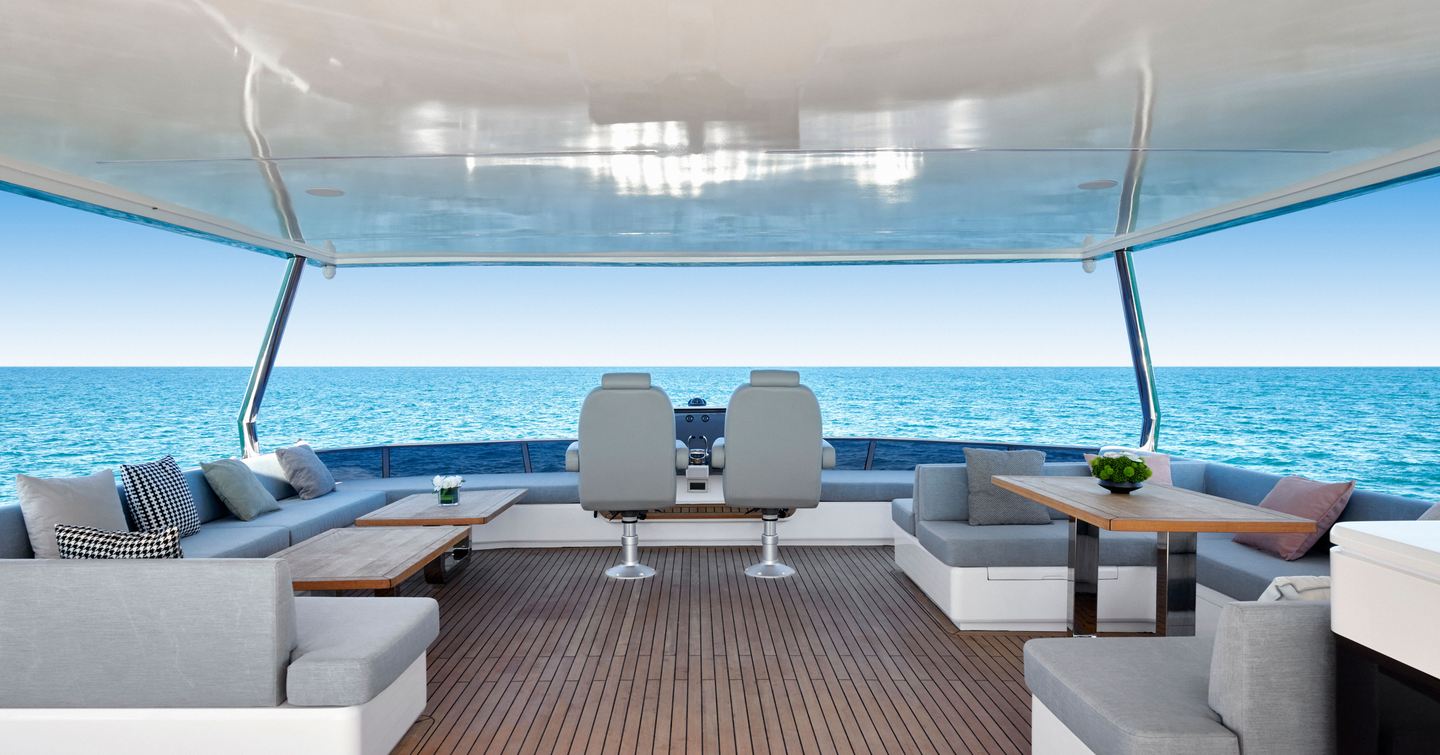 Revolution Marine Oceanwalker S60e catamaran upper deck with helm station and alfreco dining