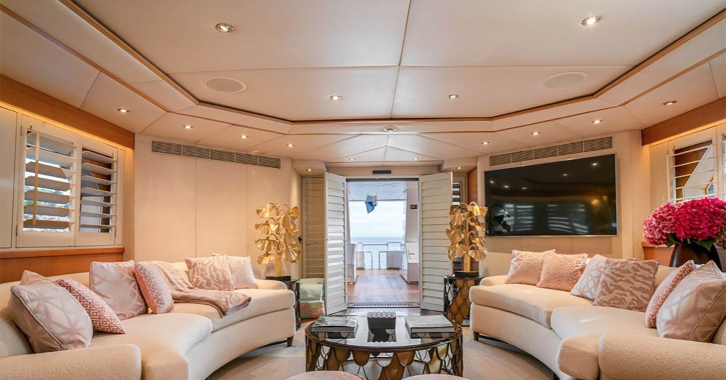 Superyacht Envy's interior seating with curved sofa's 