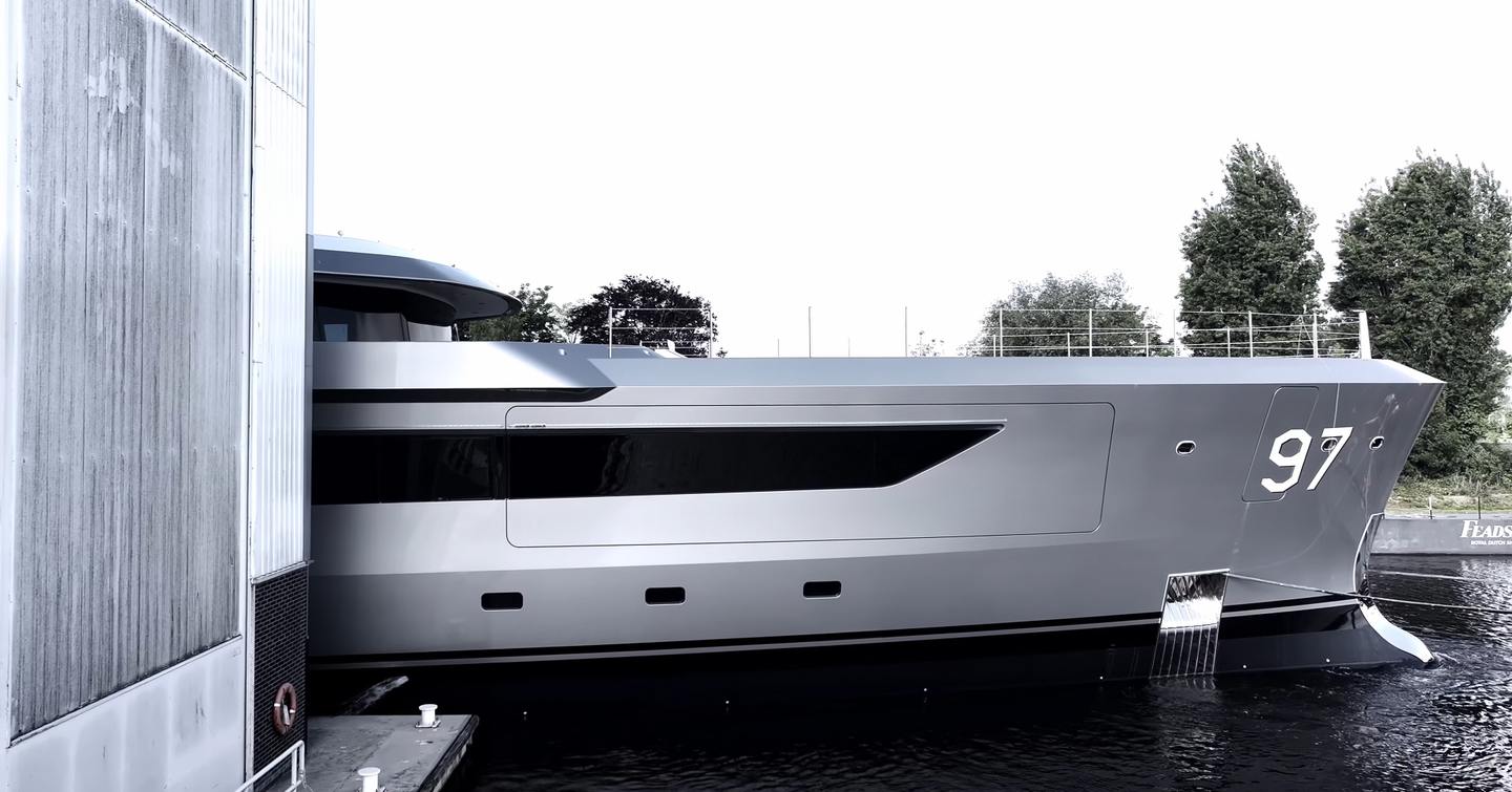 Motor Yacht Valor Bow emerging from finishing shed at Feadship