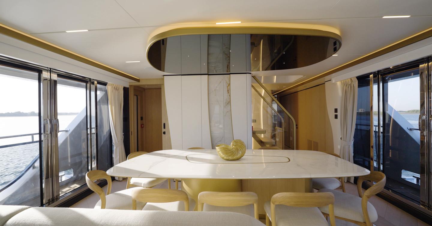 Formal dining area aboard the Gulf Craft Majesty 100 Terrace with opening side doors