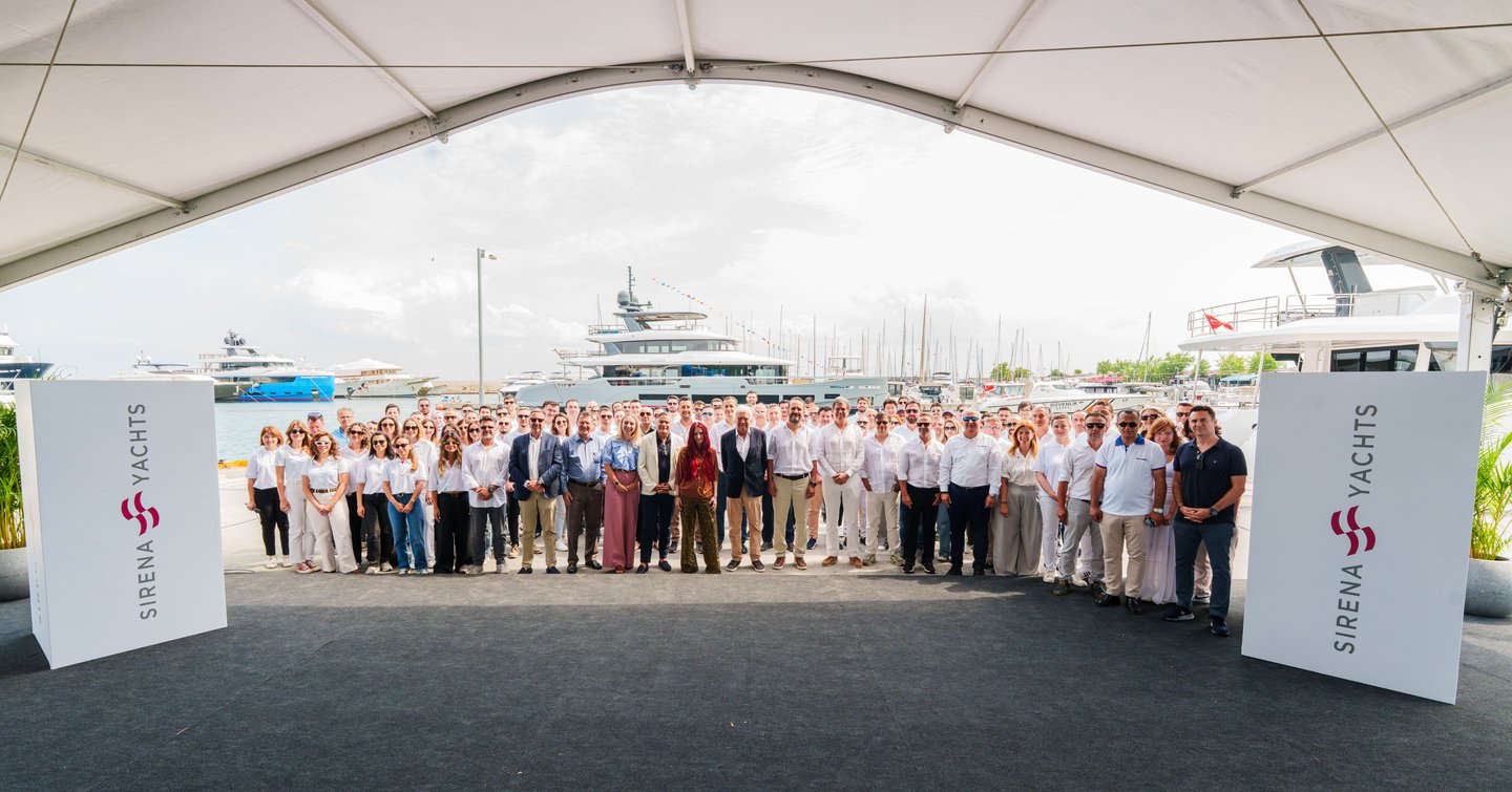 Sirena yachts team in front of First Sirena 118 superyacht at launch