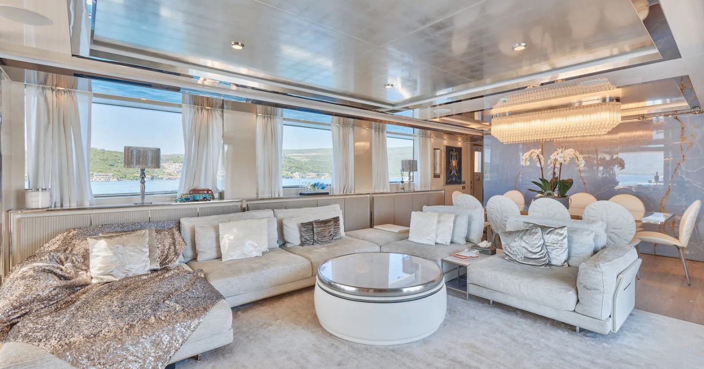 Soft furnishings within spacious interior lounge on superyacht Amorcito