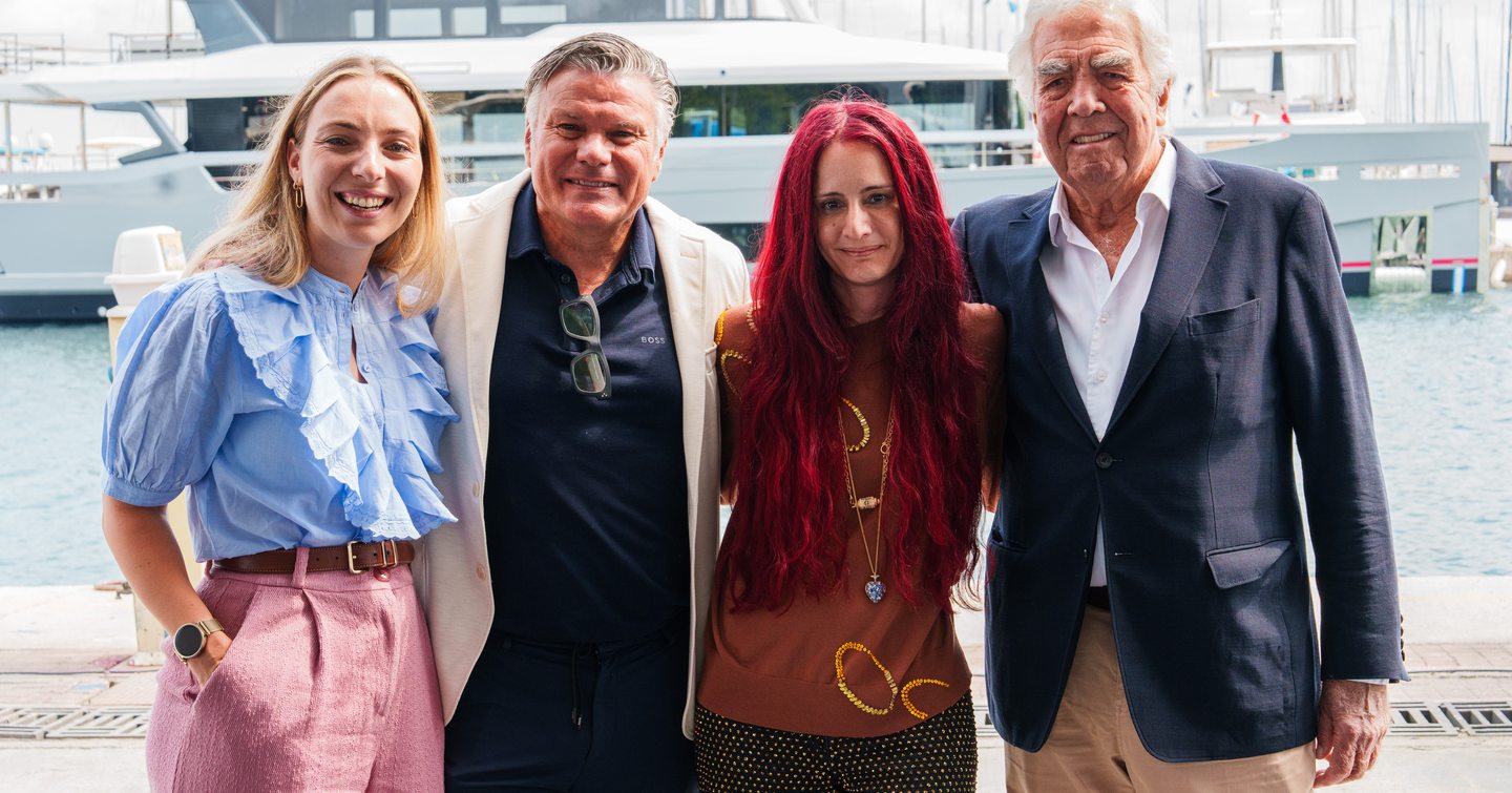 Superyacht designers in front of First Sirena 118 superyacht at launch