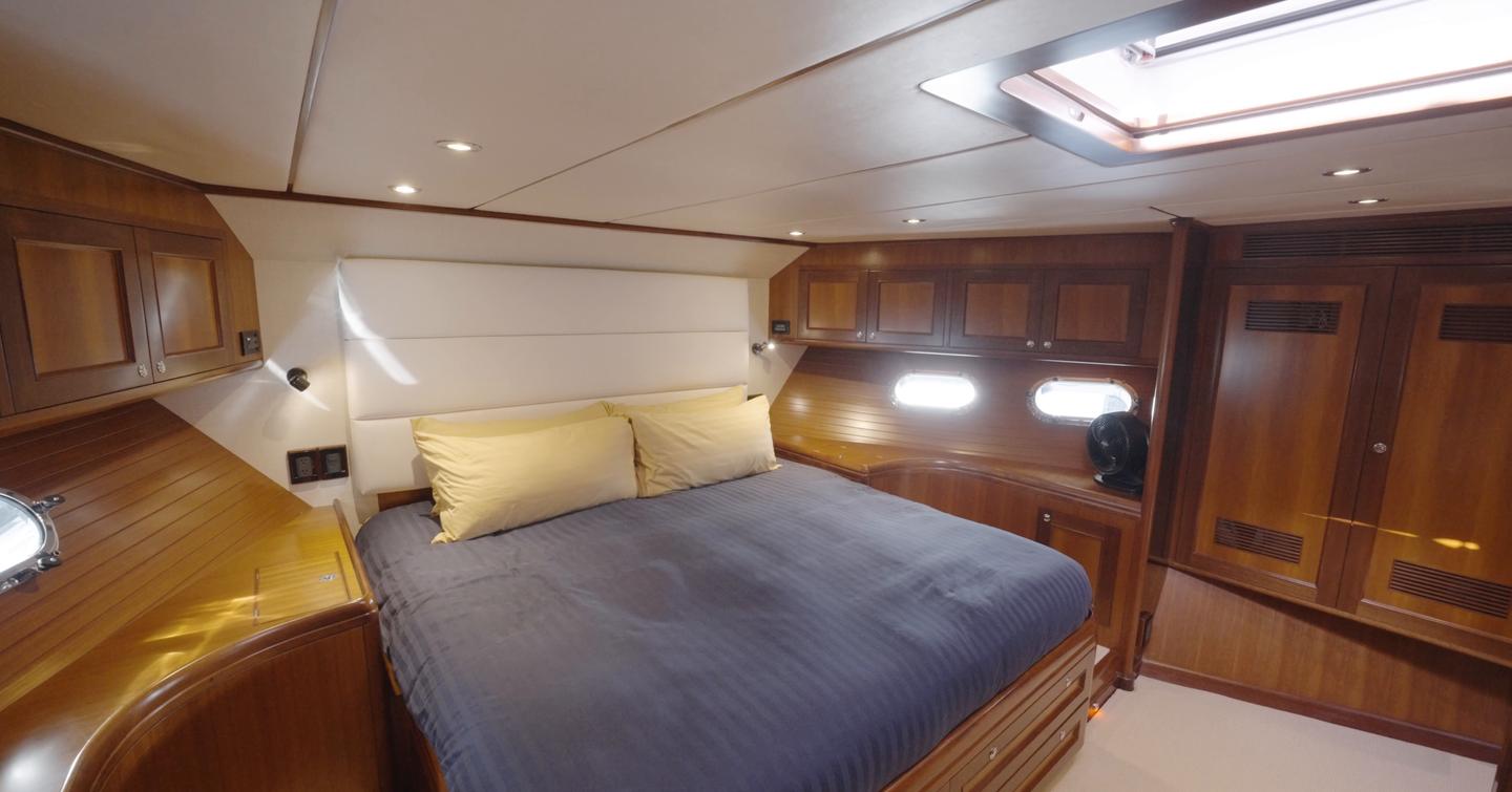 Nordhavn 75 EYF owner's cabin with island double berth, skylight and extensive wardrobe storage
