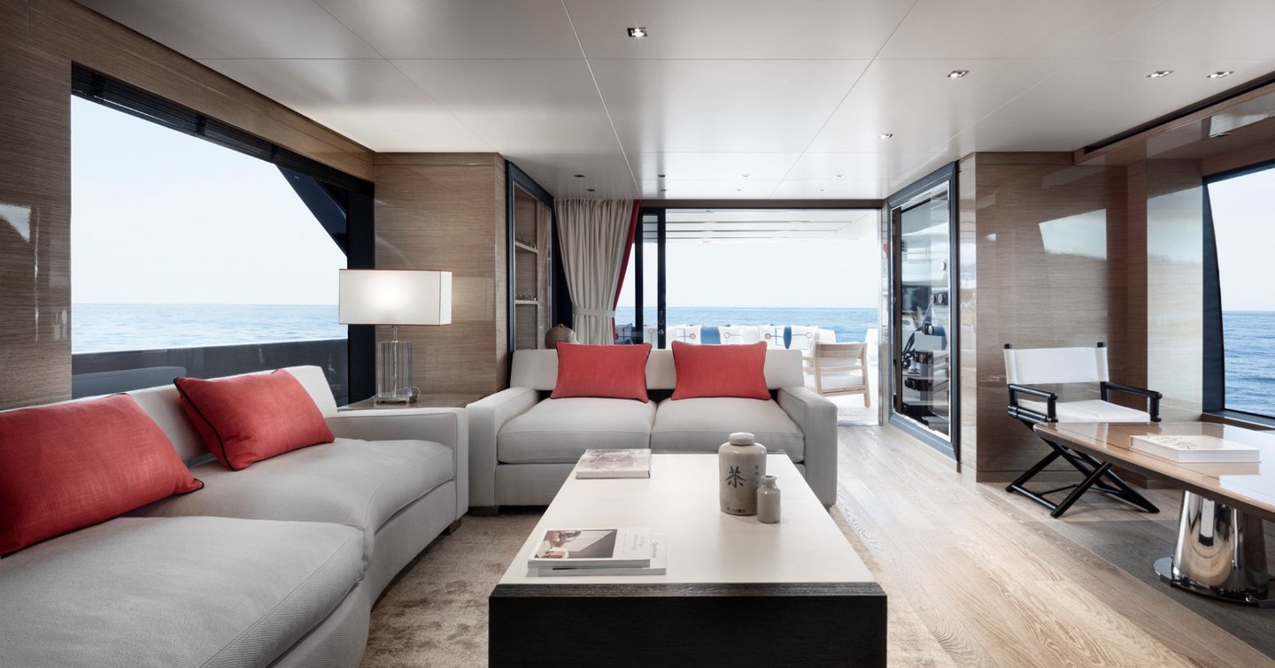 Main salon with L-shaped sofas on board new SL96 Asymmetric