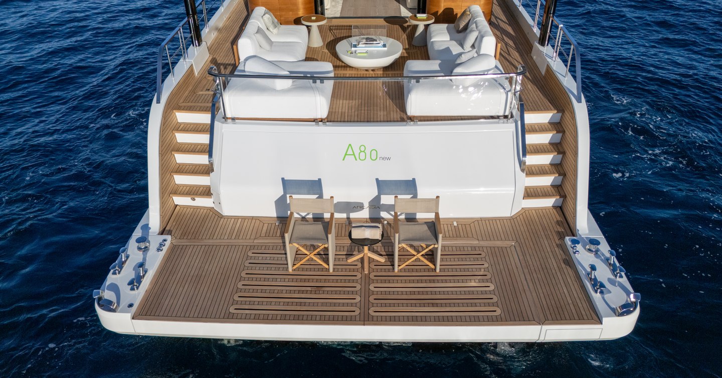 Arcadia A80new Superyacht beach club with deck chairs and white sofas 