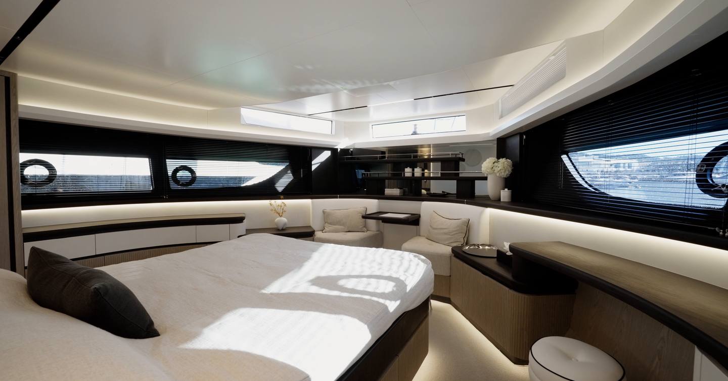 Pearl 73 forward owner’s cabin with double bed and wraparound hull windows