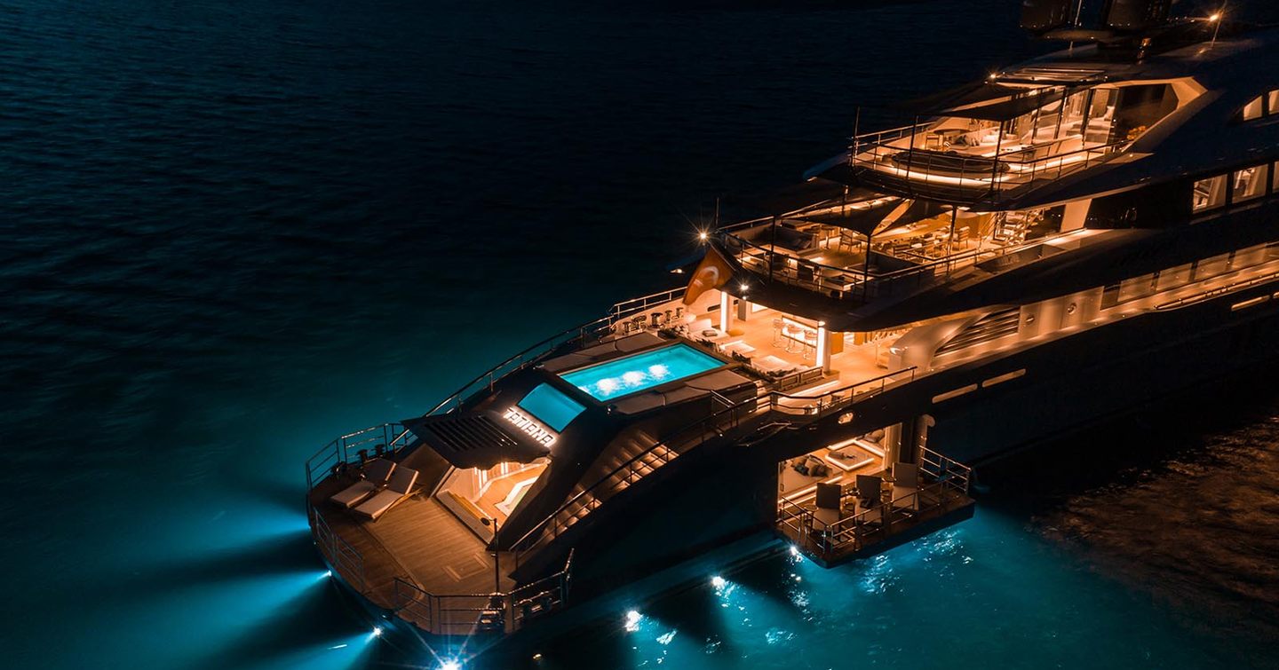 View of aft of superyacht TATIANA, lit up at night