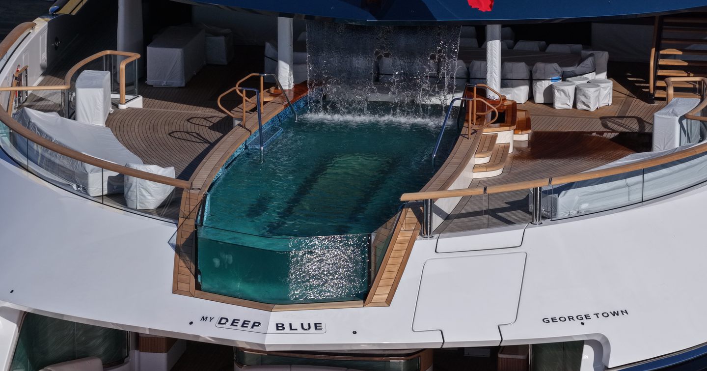 Close up of Superyacht Deep Blue's cascading waterfall into aft infinity pool