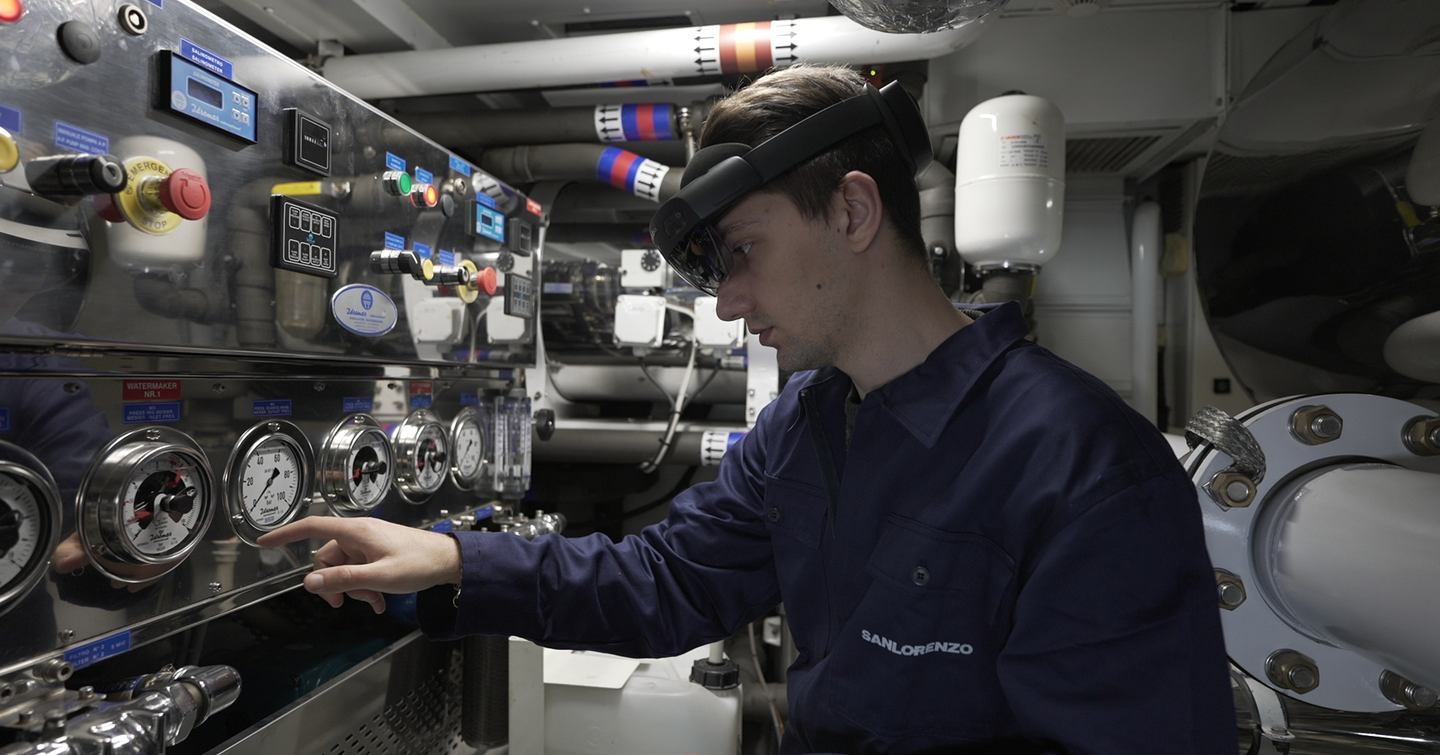 Man wearing Sanlorenzo smart helmet in engine room