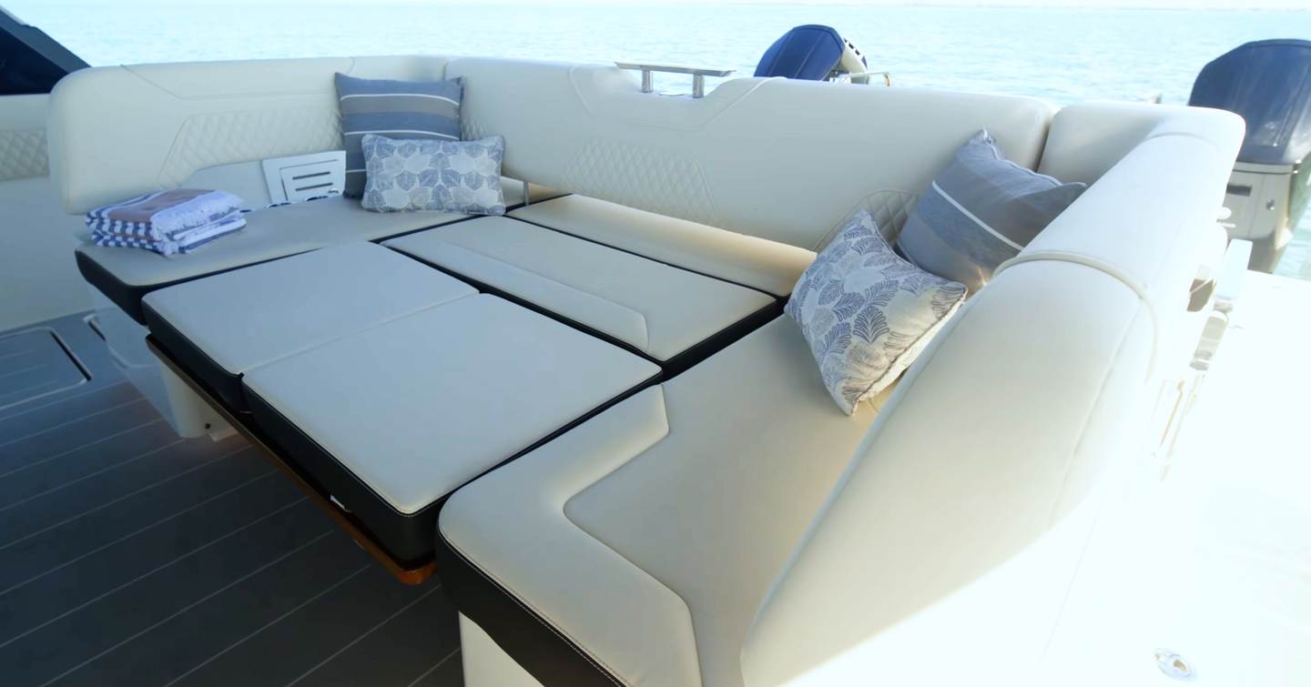 Aquila 45 Sport cockpit seating converted into sunpad with adjustable backrests, showing flexible lounging layout at aft deck