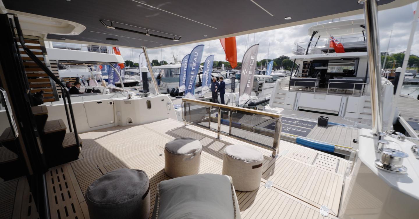 Beneteau Grand Trawler 63 aft cockpit with covered seating area and hydraulic swim platform access