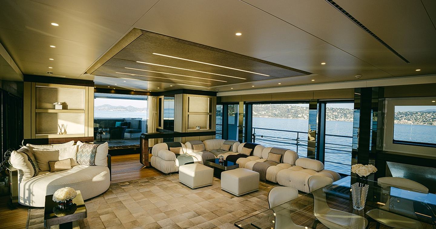 Superyacht Batarli's main saloon with L-shaped sofa