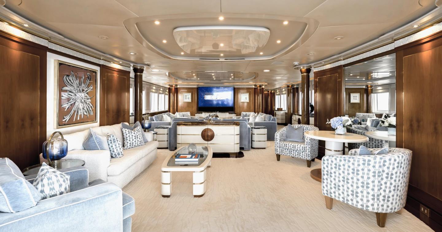 Superyacht Olympus main saloon with plush grey seating 