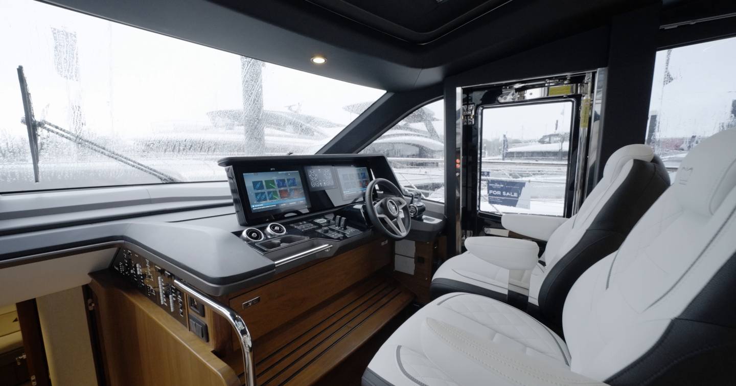 Princess S65 Mk2 lower helm station with twin seats, side door and navigation displays
