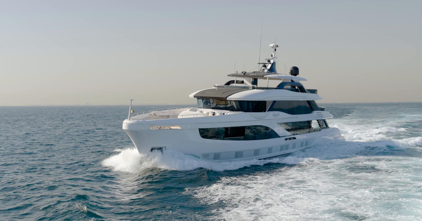 Gulf Craft Majesty 145 underway at cruising speed showing the starboard profile and raised pilothouse design