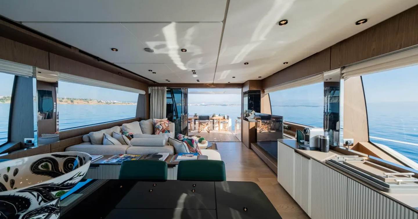 Motor Yacht Dogu main saloon with L-shaped sofa and dining area 