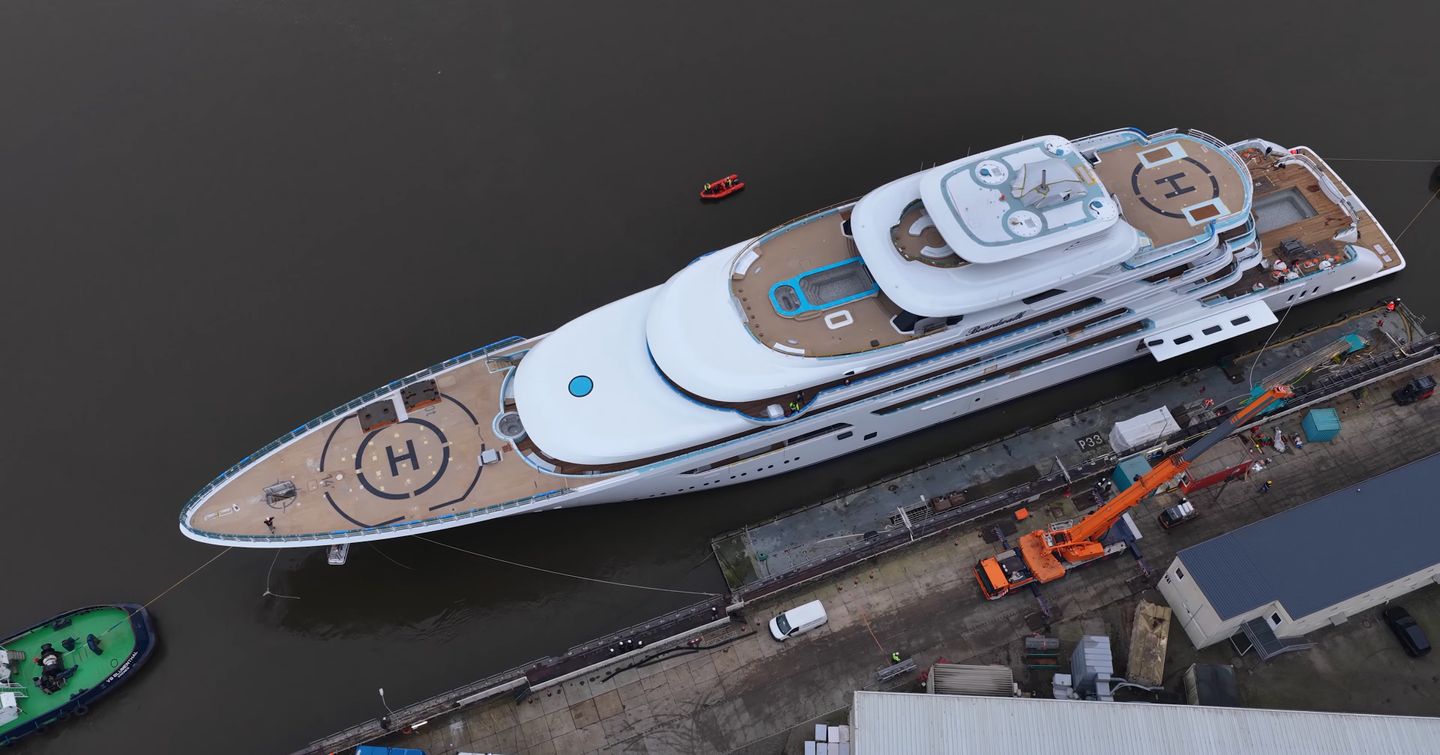 Aerial view of Superyacht Boardwalk docked outside Lurssen shipyard 
