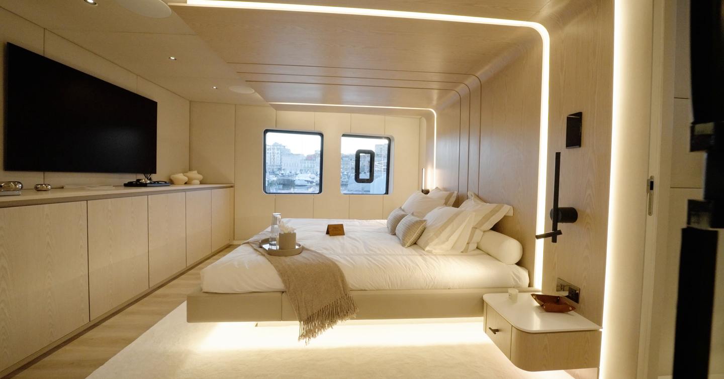 Sunreef Ultima 88 full-beam owner’s cabin with low bed and large hull windows