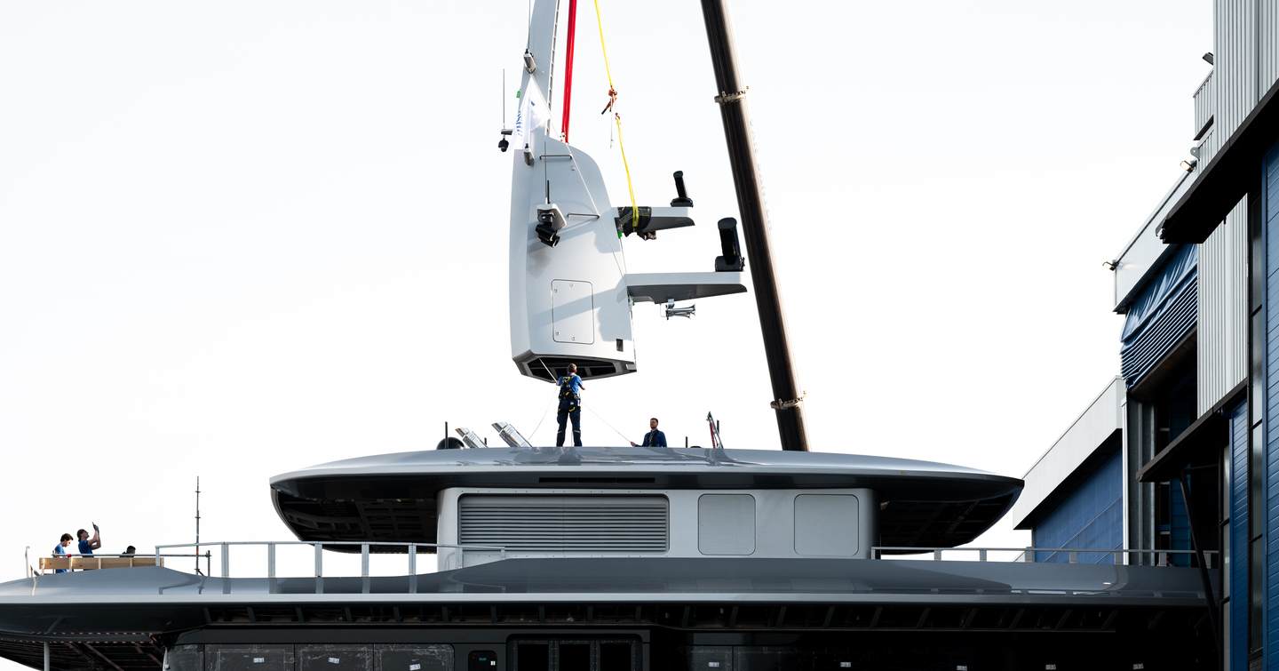 Workers on upper deck of Feadship Superyacht Thalassa (Project 826) attached to crane