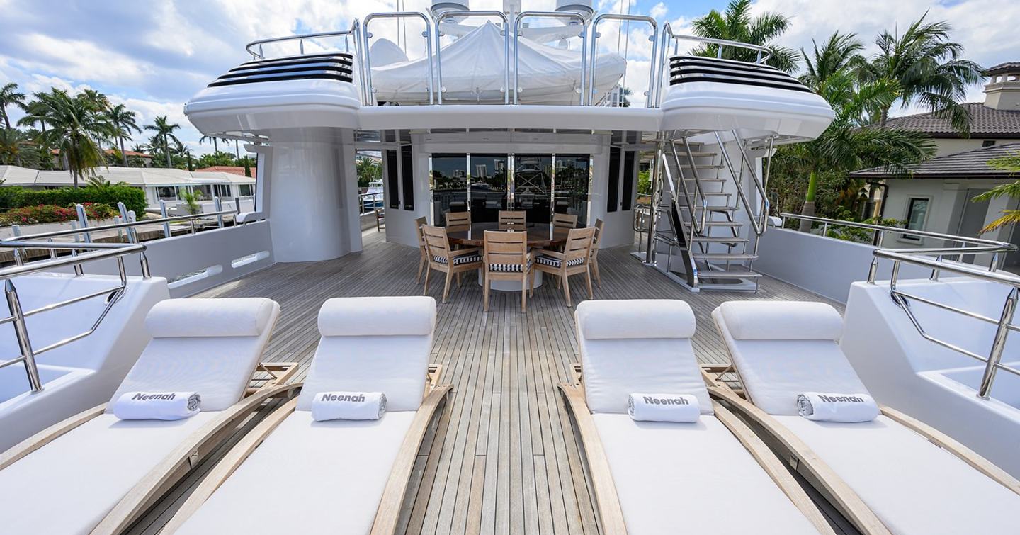 Superyacht Neenah skylounge aft deck with white sunloungers