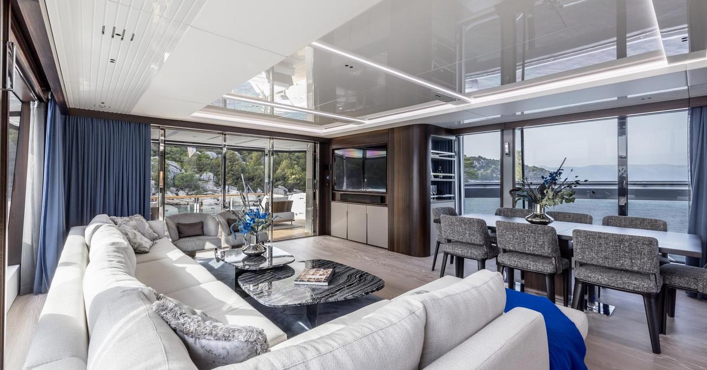 Motor yacht Exit's L-shaped sofa and mounted TV