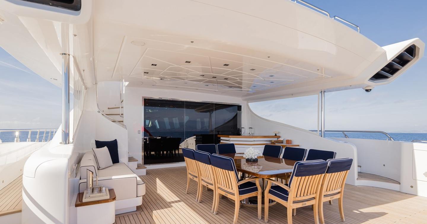 Superyacht Royale X aft deck with shaded alfresco dining