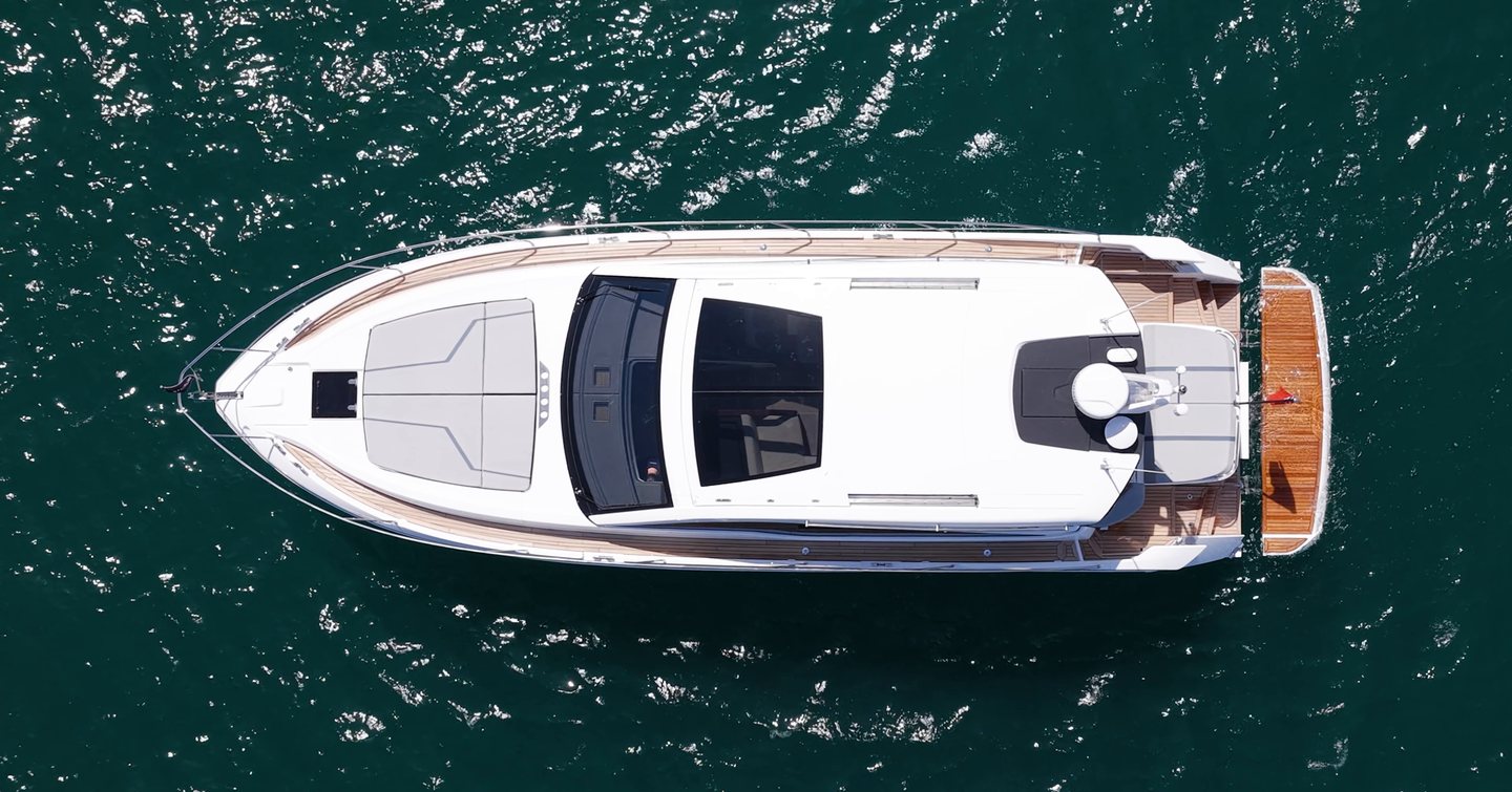 Overhead view of the Fairline Targa 47 GT showing the hardtop, foredeck sunpad and hydraulic bathing platform