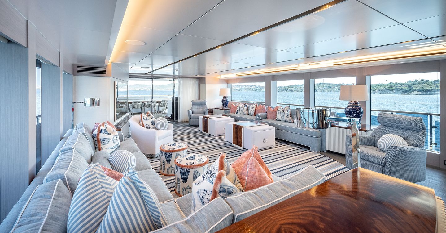Motor yacht Orpheus main saloon with L-shaped sofas