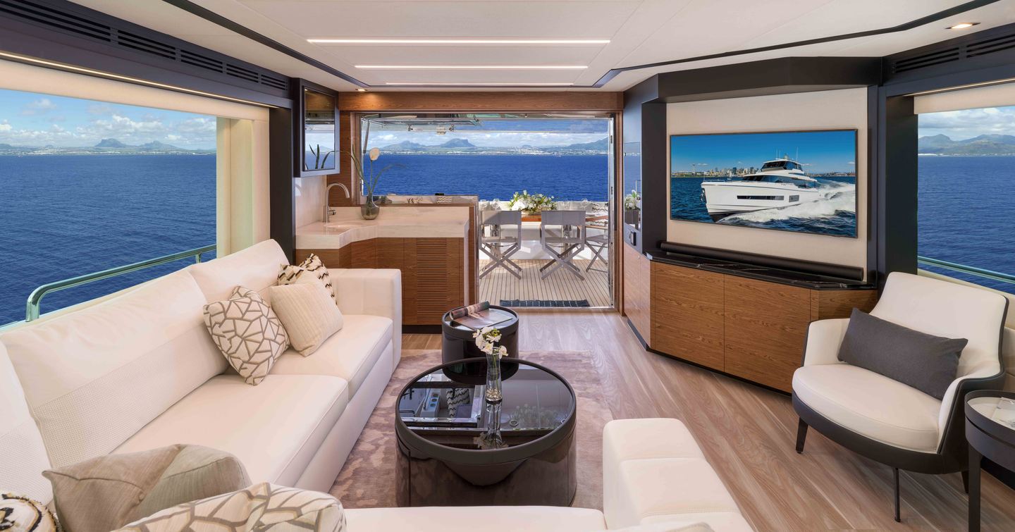 Horizon V77S Hull 13 motor yacht saloon with L-shaped white sofa and mounted TV