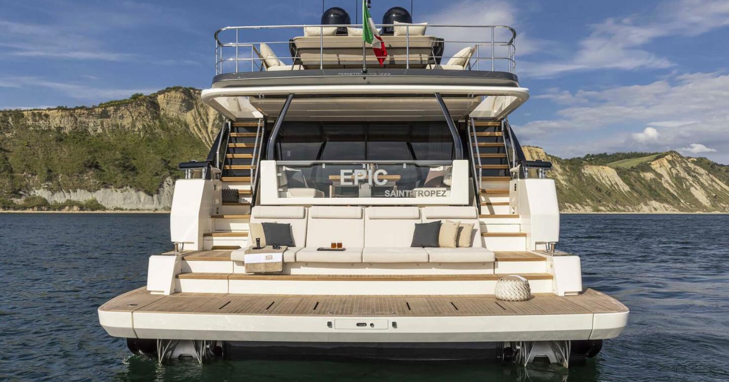 Superyacht Epic's stern with beach club and aft deck alfresco dining