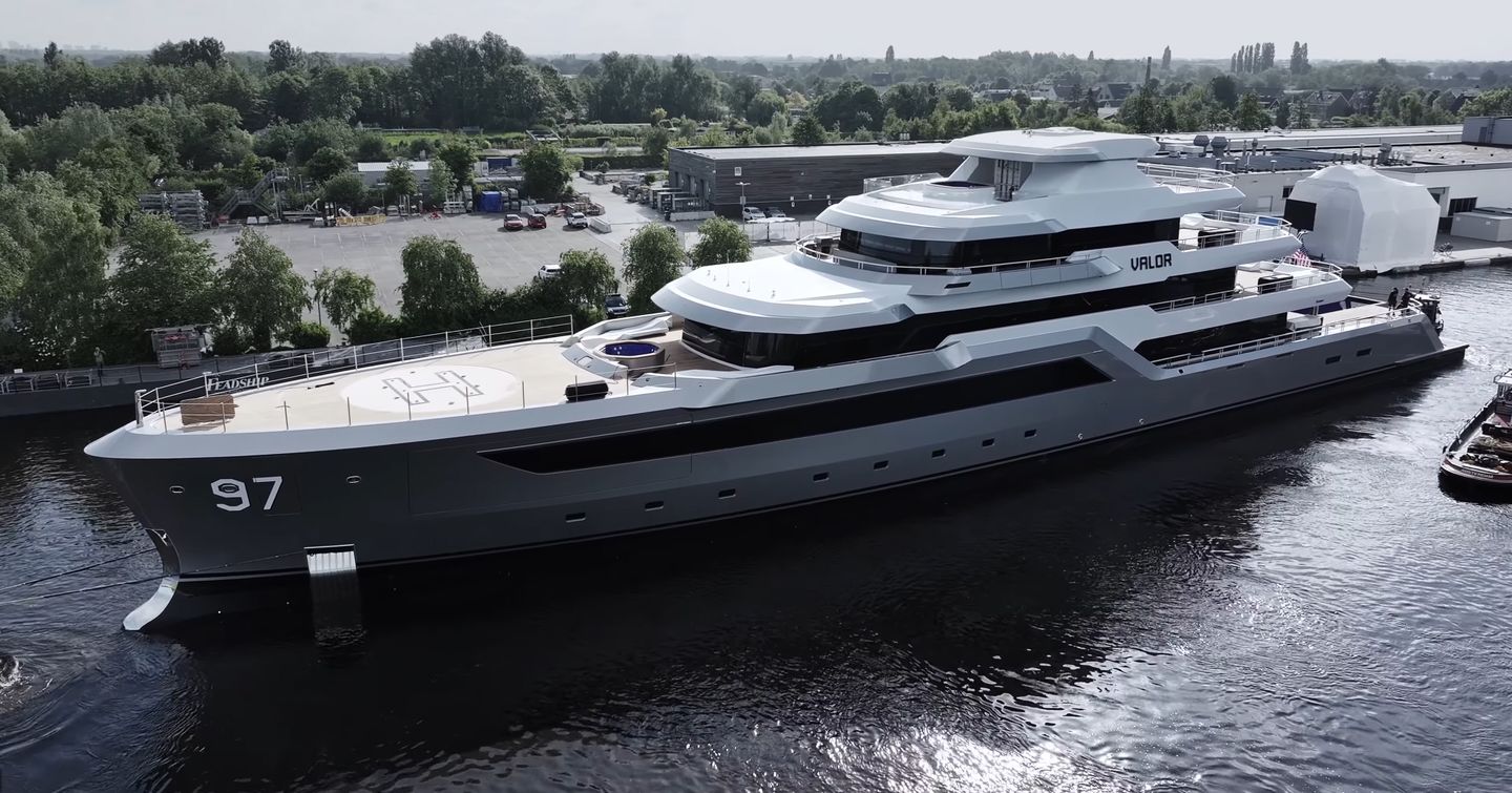 Superyacht Valor docked outside shipyard 
