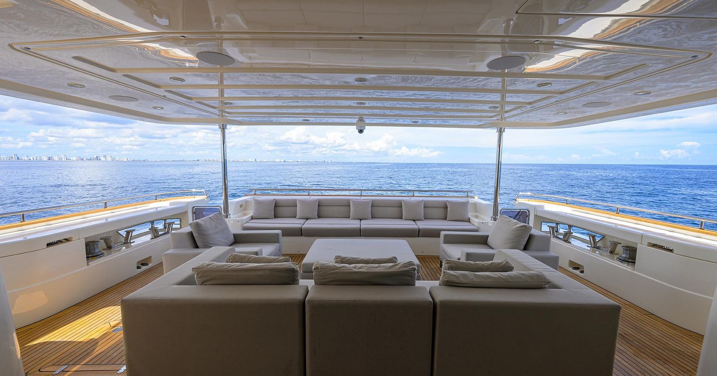 Motor yacht Argento's lower deck seating shaded seating area