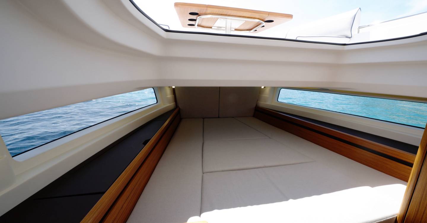 Aiata-Wayfinder-38-Suntop-Review-forward-cabin-double-berth-with-side-windows-and-sunroof