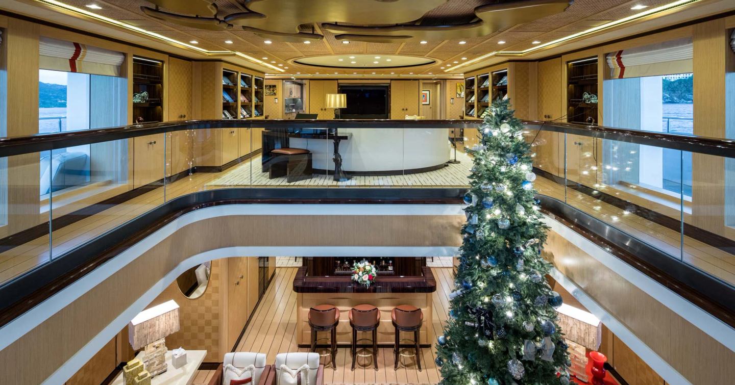 First double-height main salon with a mezzanine lounge on a superyacht