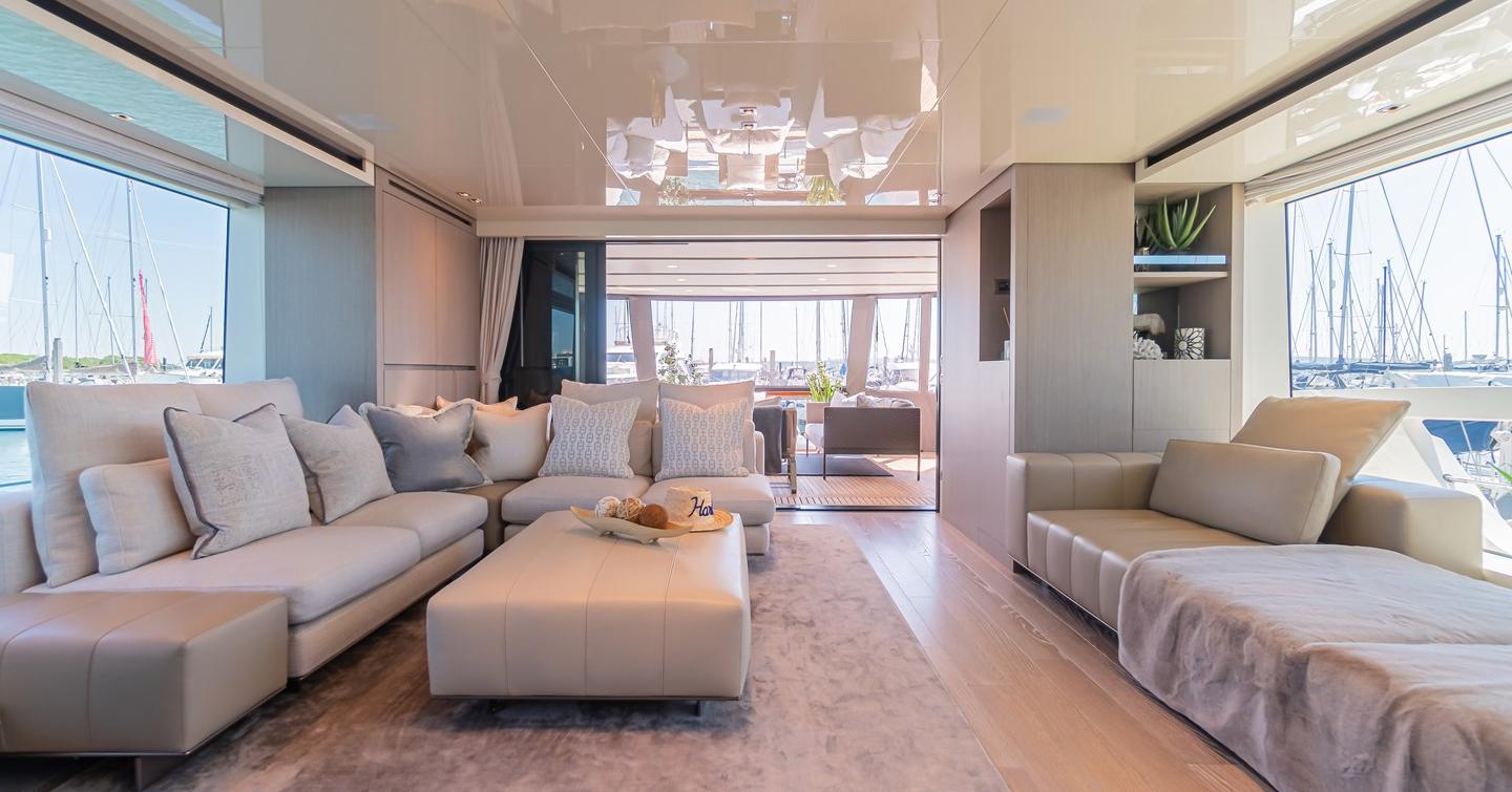 Motor yacht Hard 8's main saloon with L-shaped sofa 