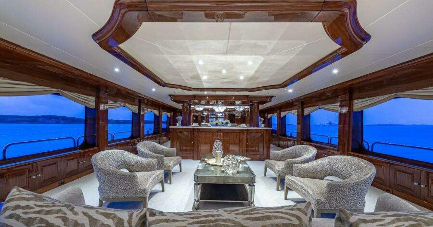 Superyacht Silver Lining's main saloon with bar and seating area