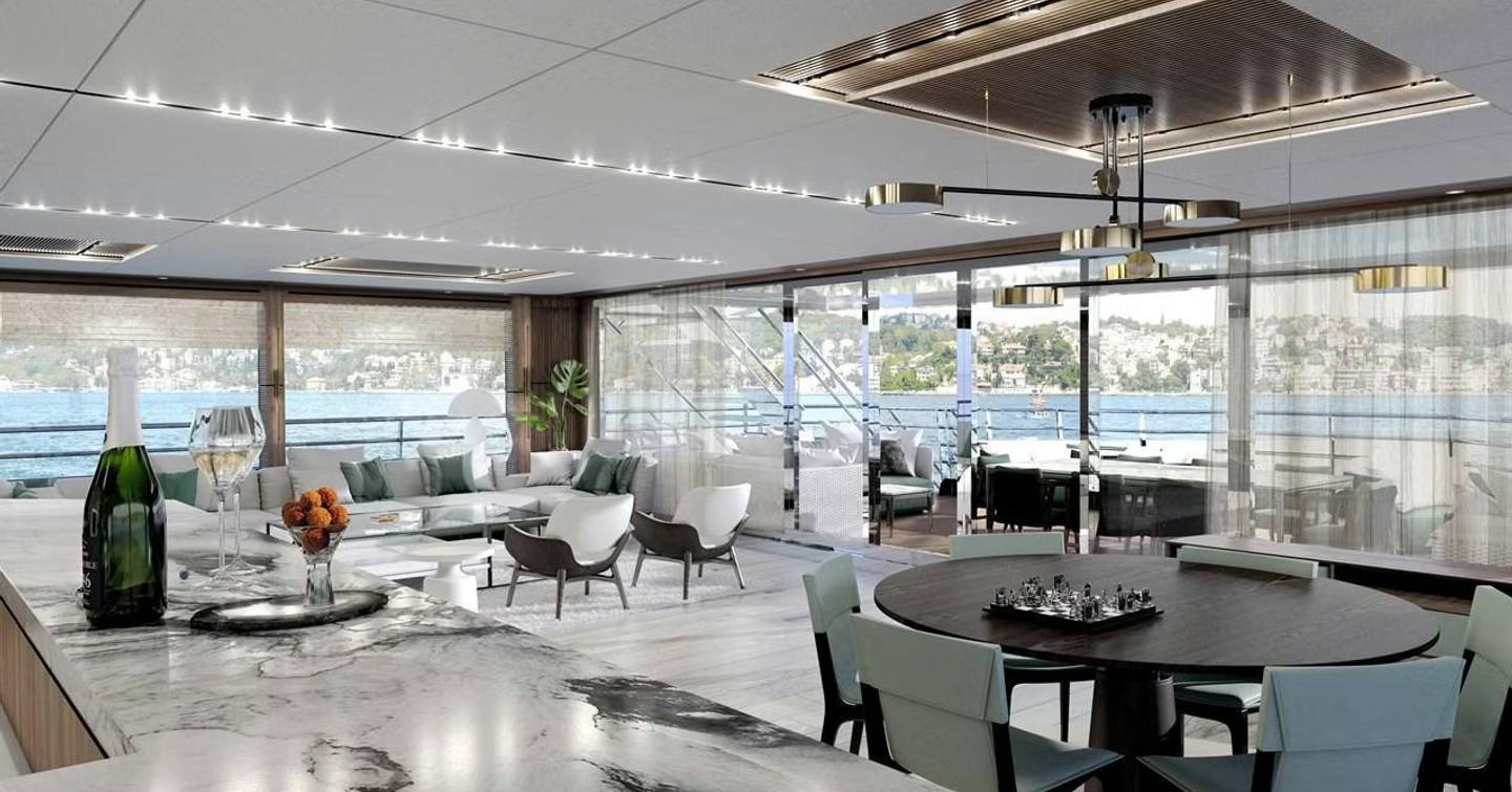 Leapher expedition yacht Horizon's main saloon with circular dining table and marble accents