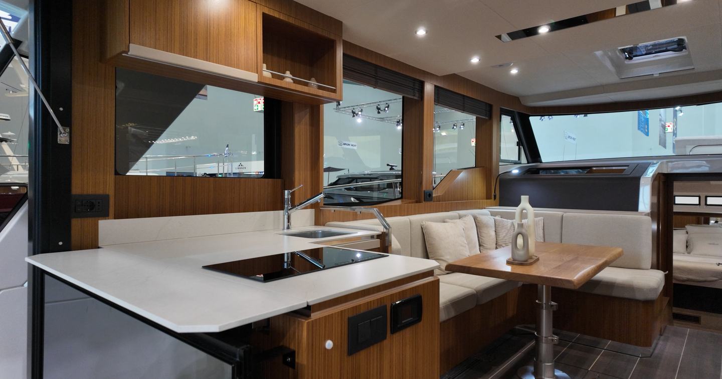 Greenline 42 saloon with split galley layout, electric drop-down windows and dinette seating