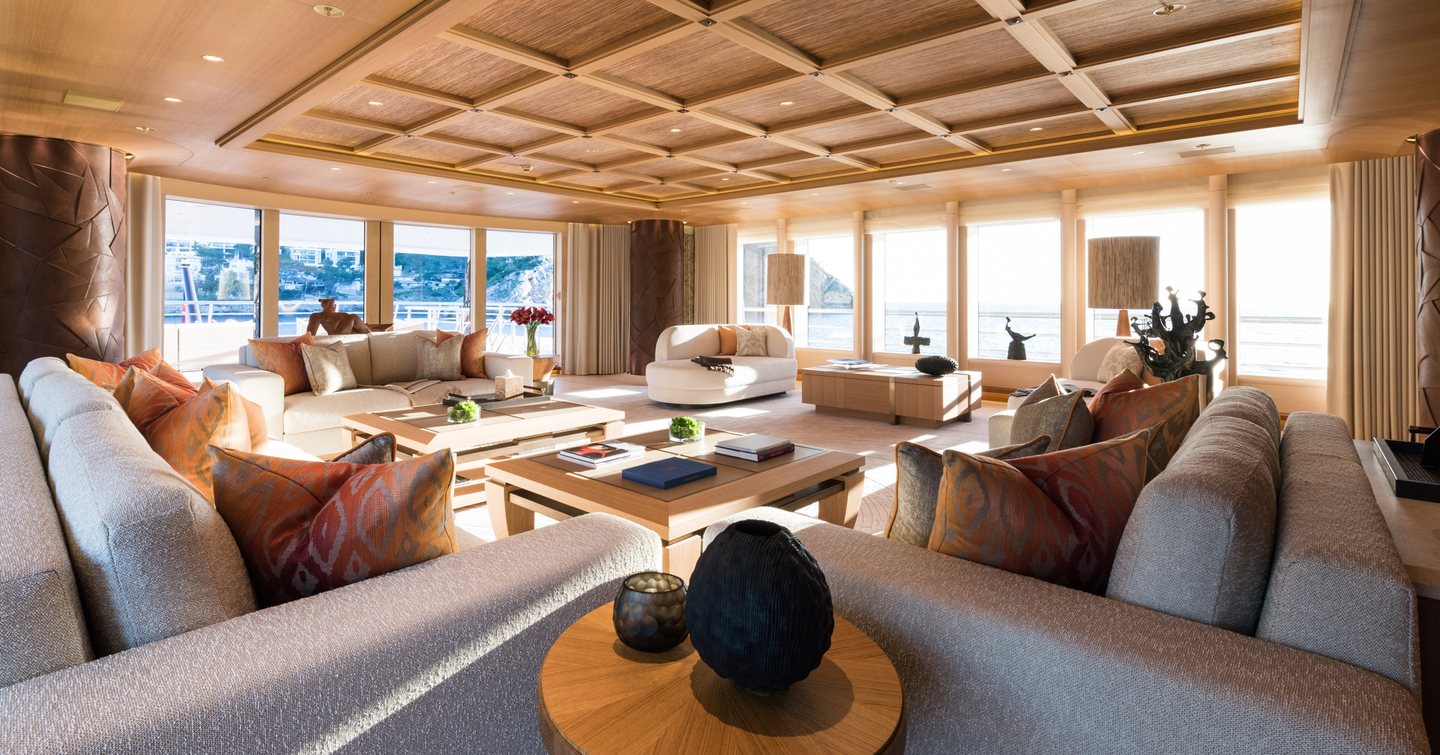 Superyacht Here Comes The Sun lounge with wooden ceiling and grey furniture 