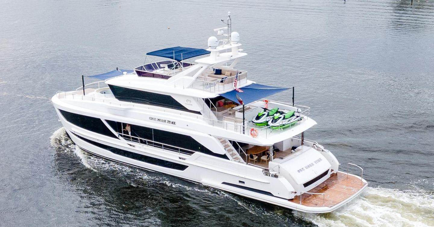 Motor Yacht One More Time under way with tender on board